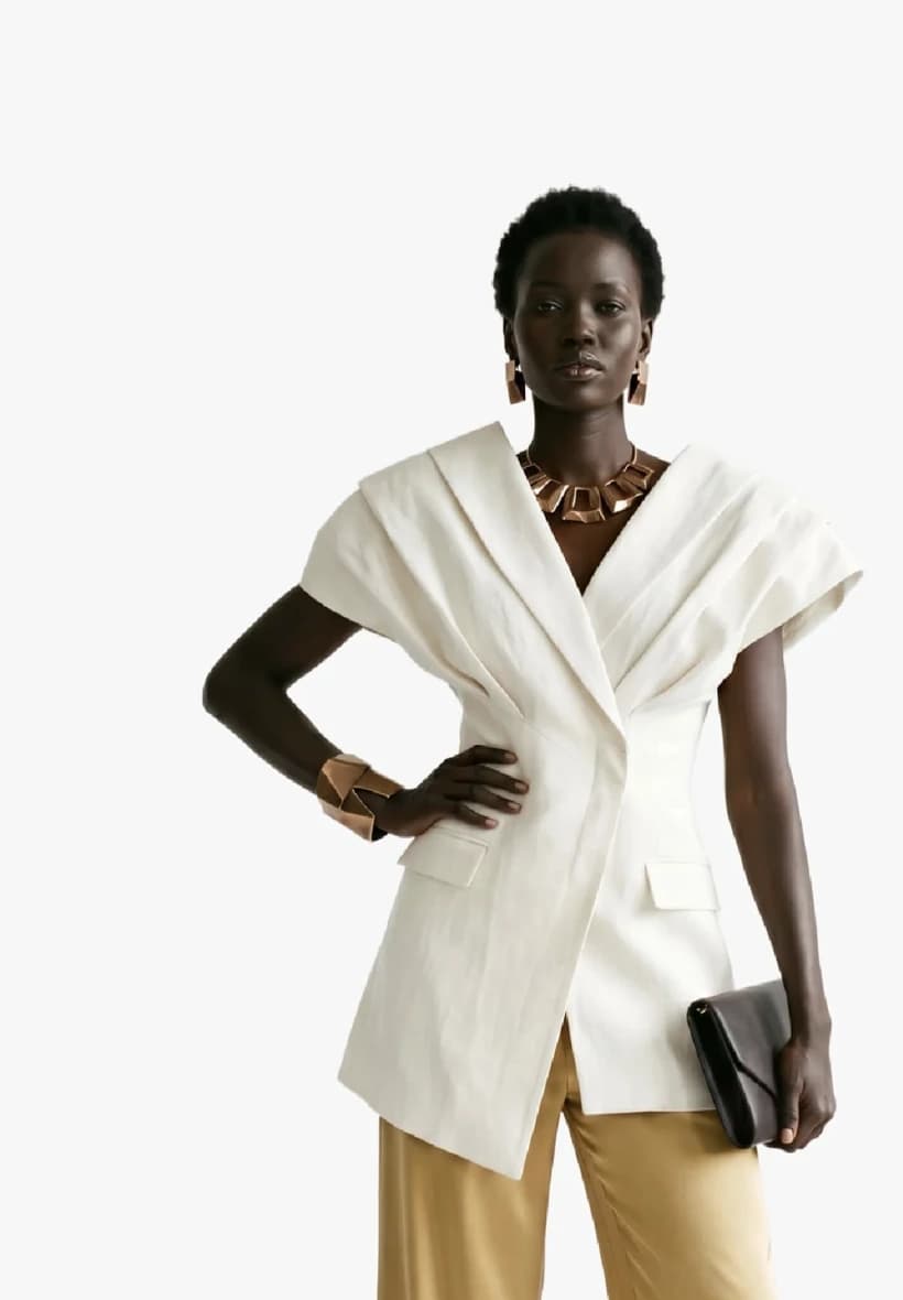 Fashion team member wearing a white tailored jacket